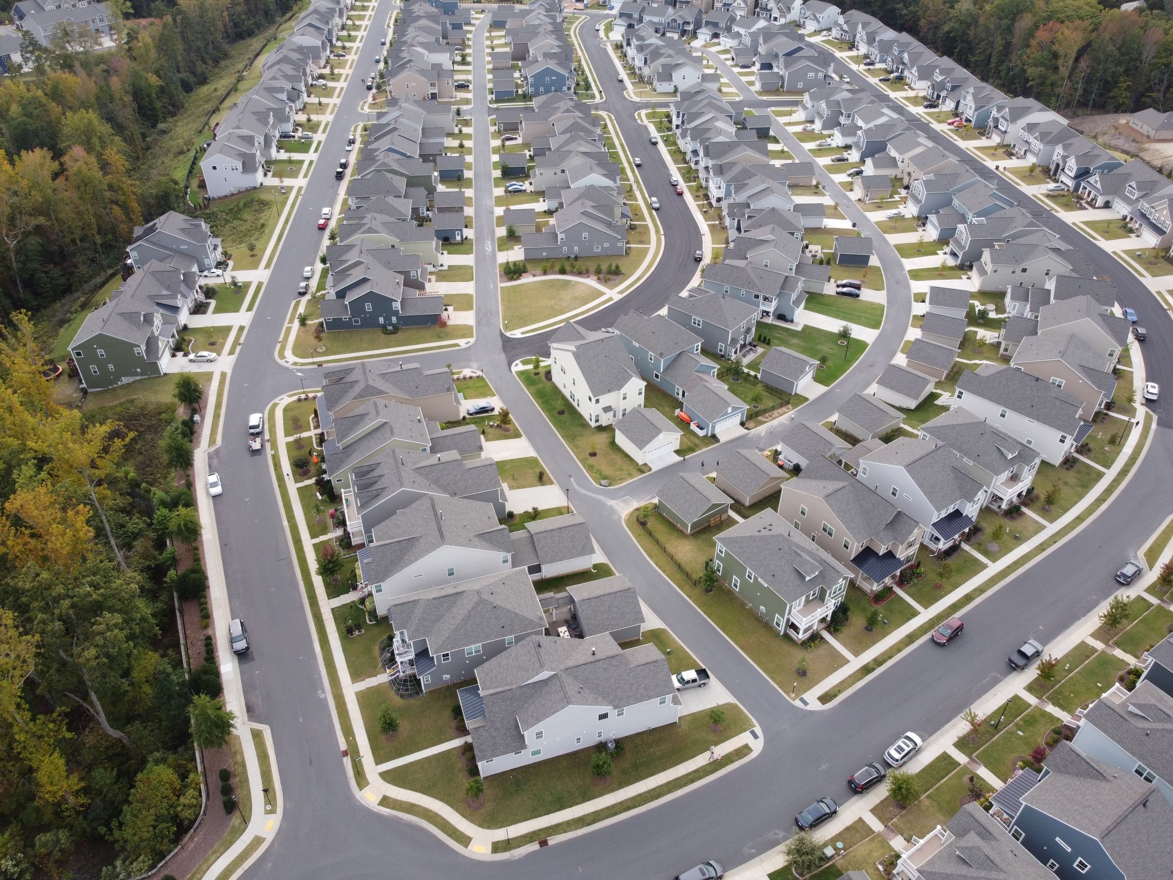 Rooftops across a neighborhood, illustrative