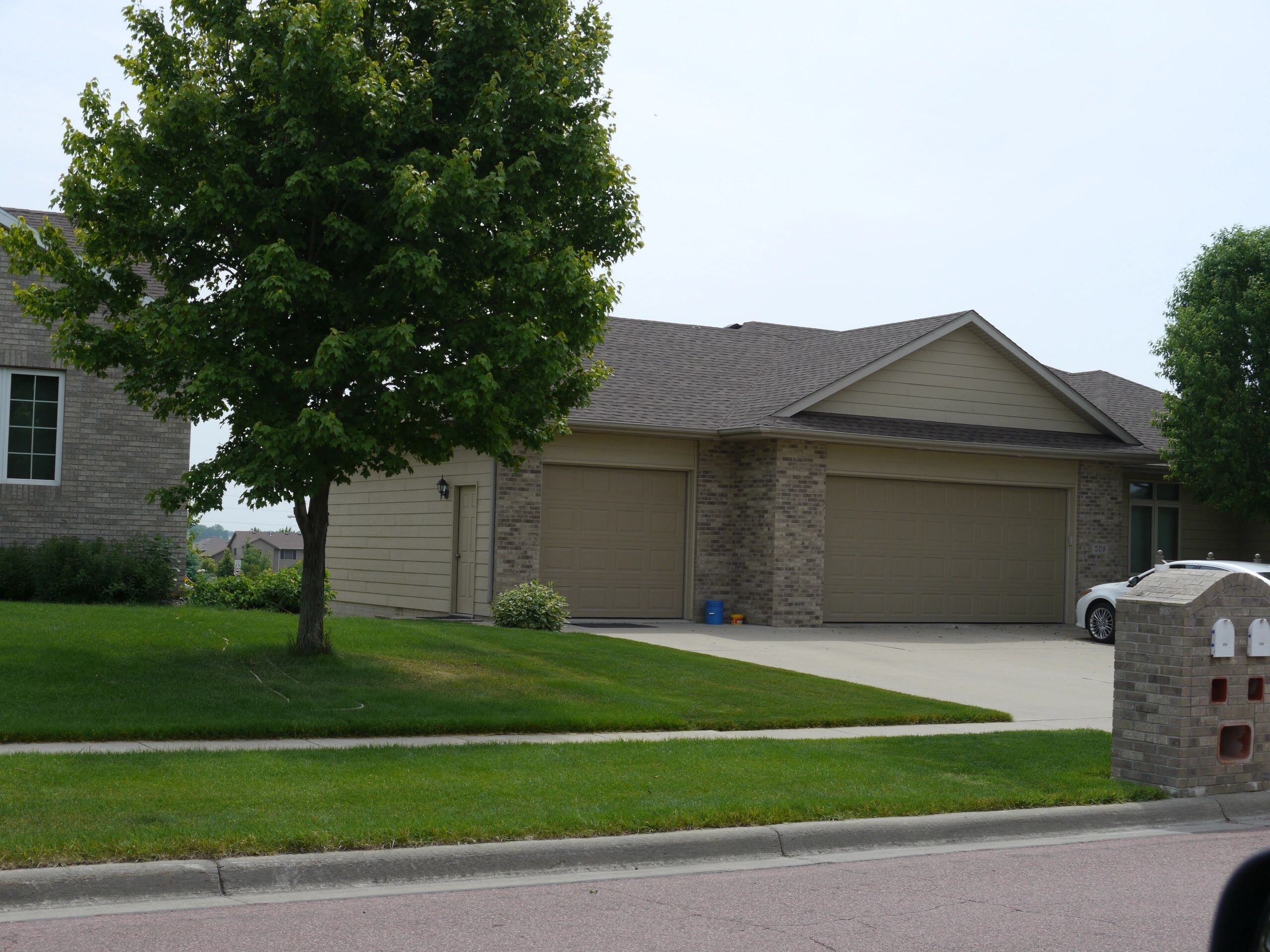 A completed roof on a suburban home, seen from the street
