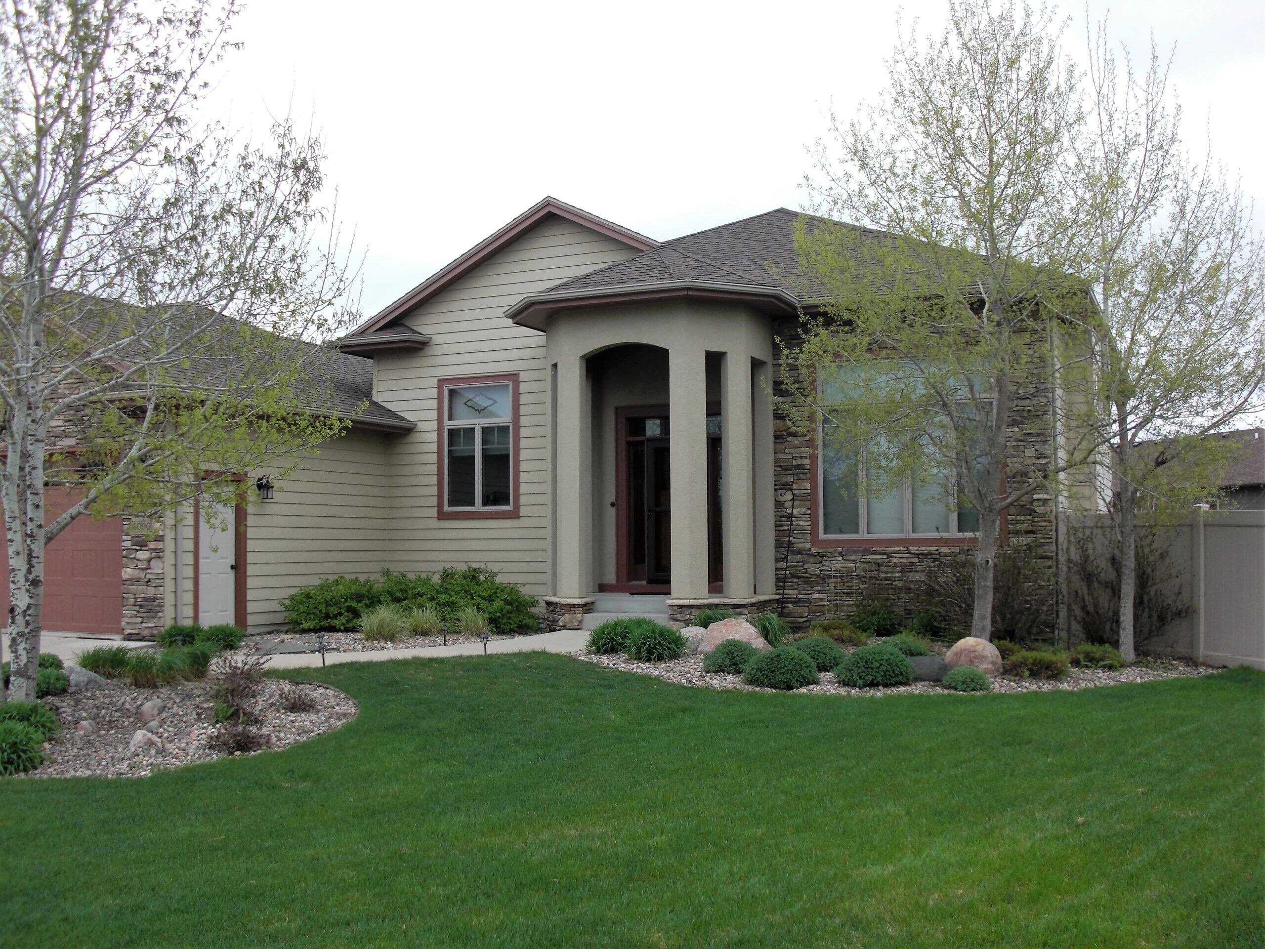 A completed re-roof on a single-storey home with stone accents